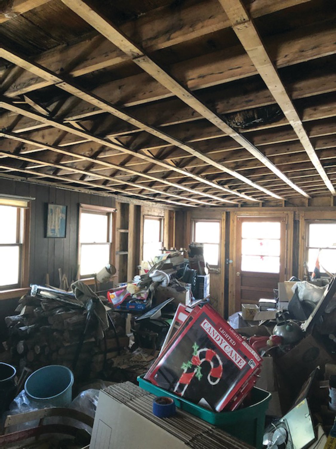 POST-STORM CHAOS: Last year, as his home of 60 years crumbled around him, 91-year-old Korean War veteran Bernie Pavia inspected the damage. The past year’s been rough, but the repairs are finally almost done and he’s back at home again.